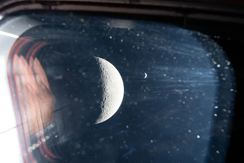 The Earth and moon seen out of the Artemis II capsule