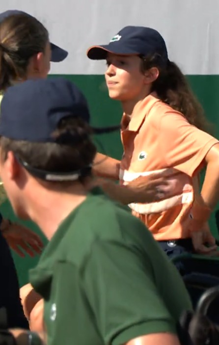 A ball girl is sat down as she was in distress due to the heat at the French Open on May 25, 2026.