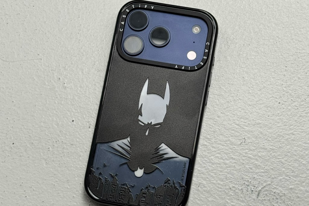 Black iPhone case with a Batman graphic.