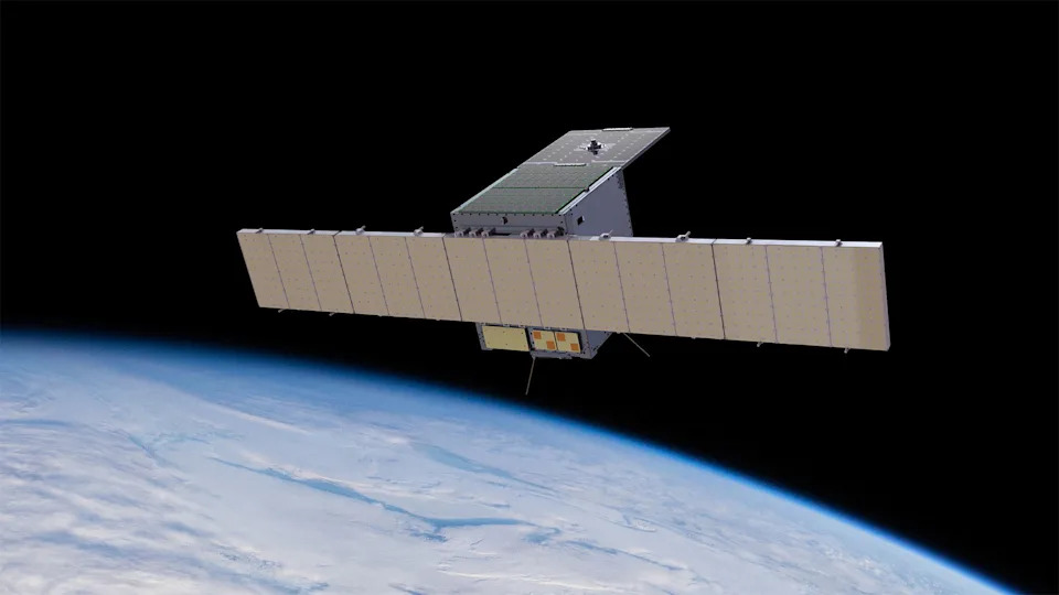 an illustration of a cube-shaped spacecraft with two wing-like solar panels