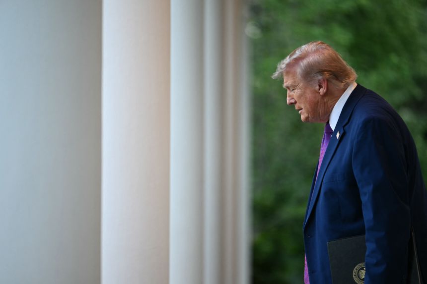 President Donald Trump walks to the Rose Garden at the White House on May 11.
