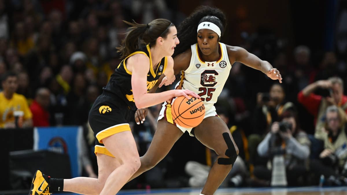 Iowa Hawkeyes guard Caitlin Clark (22) dribbles the ball against South Carolina Gamecocks guard Raven Johnson (25) in the 2024 NCAA Tournament.Ken Blaze-USA TODAY Sports