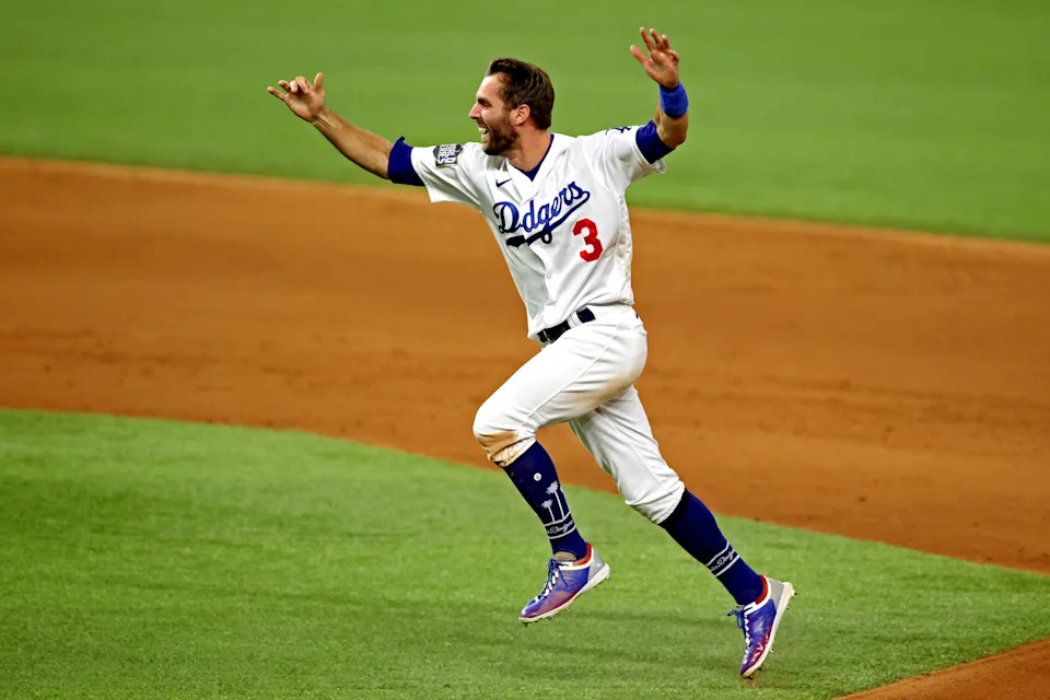 Oct 27, 2020; Arlington, Texas, USA; Los Angeles Dodgers second baseman Chris Taylor (3) celebrates after the Los Angeles Dodgers beat the Tampa Bay Rays to win the World Series in during game six of the 2020 World Series at Globe Life Field. Mandatory Credit: Tim Heitman-USA TODAY Sports