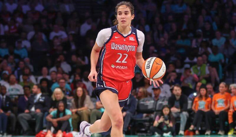 Washington Mystics guard Sonia Citron (22) brings the ball up the court.