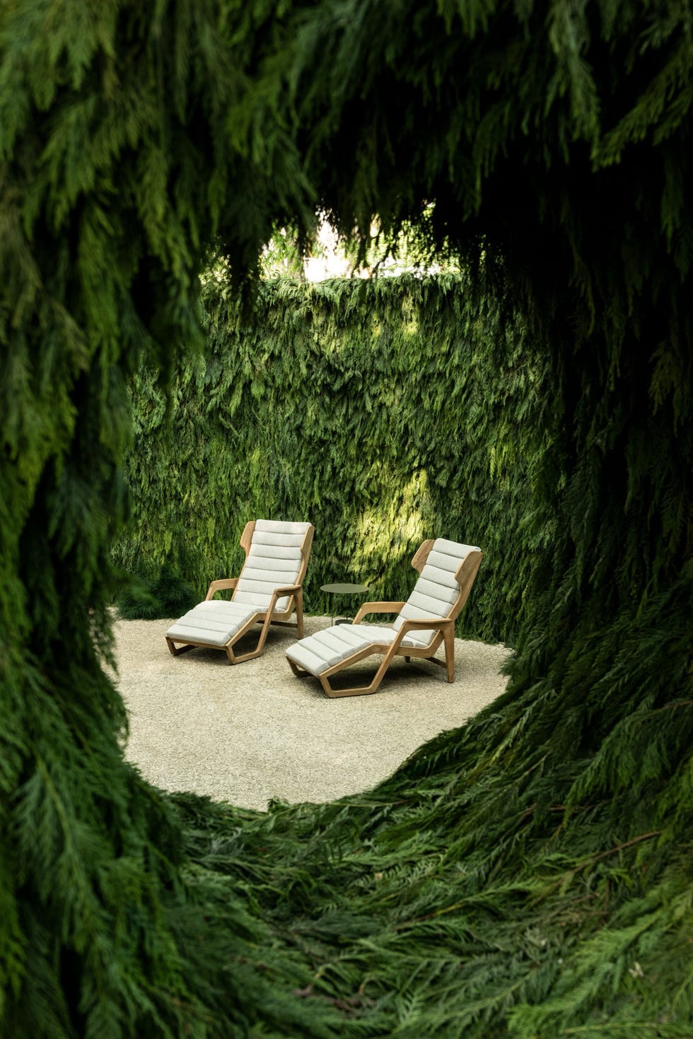 Outdoor relaxation area surrounded by greenery.