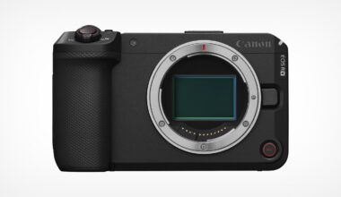 Front view of a black Canon EOS R8 mirrorless camera body, showing the lens mount and large image sensor, with buttons and textured grip visible on the left side.