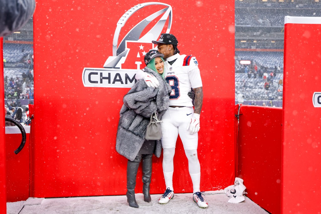 Cardi B and Stefon Diggs #8 of the New England Patriots pose for a portrait after the AFC Championship game against the Denver Broncos at Empower Field At Mile High on January 25, 2026 in Denver, Colorado. 