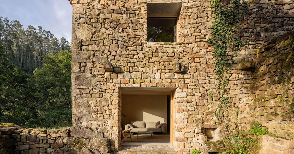 vernacular stone cabin in northern spain gains a renewed layered inner envelope