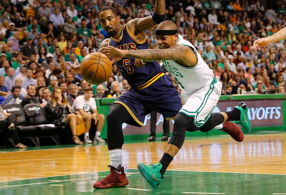 May 19, 2017; Boston, MA, USA; Boston Celtics guard Isaiah Thomas (4) reaches for a loose ball in front of Cleveland Cavaliers guard JR Smith (5) during the first half in game two of the Eastern conference finals of the NBA Playoffs at TD Garden. Mandatory Credit: Winslow Townson-USA TODAY Sports