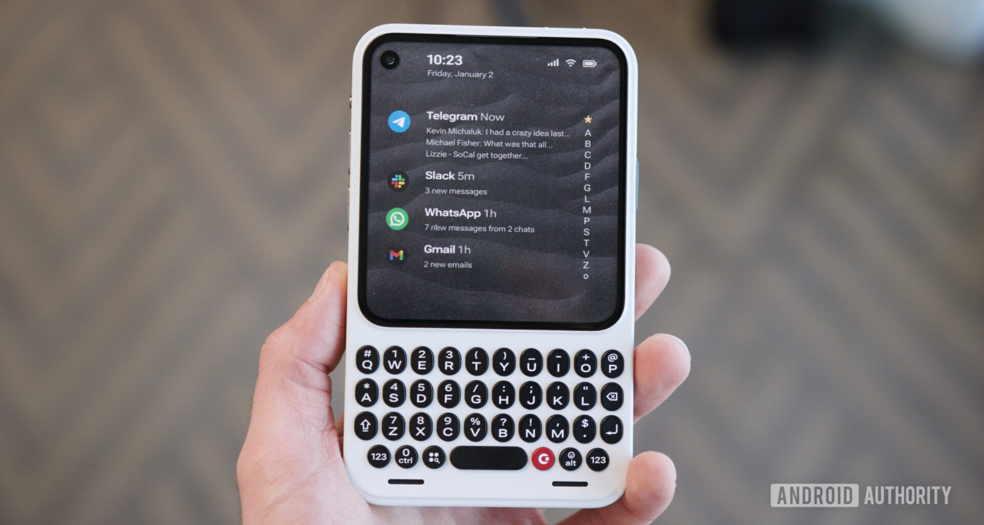 Holding the Clicks Communicator.