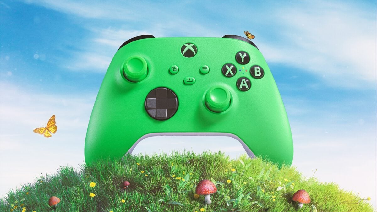A green Xbox controller sits on a hill.