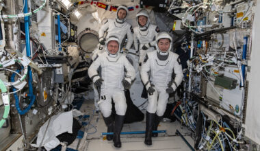 NASA's SpaceX Crew-11 astronauts gather together for a crew portrait wearing their Dragon pressure suits during a suit verification check inside the International Space Station's Kibo laboratory module. Clockwise from bottom left are, NASA astronaut Mike Fincke, Roscosmos cosmonaut Oleg Platonov, NASA astronaut Zena Cardman, and JAXA (Japan Aerospace Exploration Agency) astronaut Kimiya Yui.