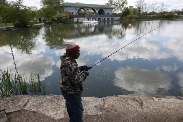 James Hardy casts a fishing rod at the Humboldt Park Lagoon Saturday, May 2, 2026, in Chicago. A lifelong Chicagoan, Hardy, 67, said he has been fishing the lagoon for 22 years, mostly for catfish and bluegill. (John J. Kim/Chicago Tribune)