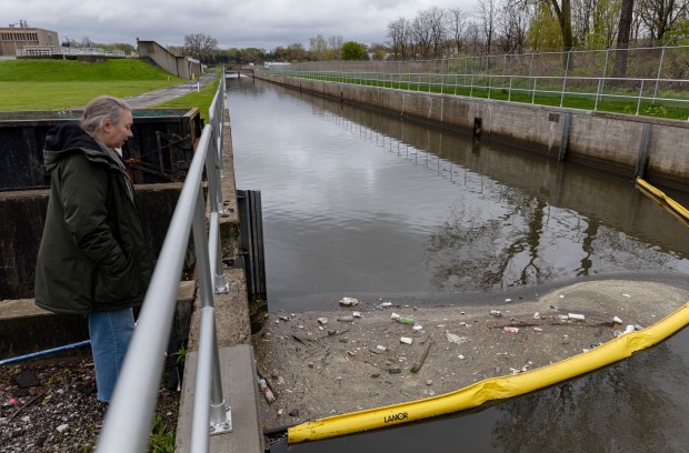 Sherri Mason, a Gannon University researcher, looks over a boom that collects plastic and other trash in a stream that flows into Lake Erie, May 1, 2026, in Erie, Pennsylvania. (Brian Cassella/Chicago Tribune)
