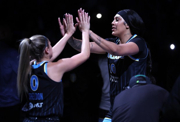 Sky guard Jacy Sheldon (0) and center Kamilla Cardoso high-five during player introductions for a preseason game against the Dream on April 29, 2026, at Wintrust Arena. (Chris Sweda/Chicago Tribune)