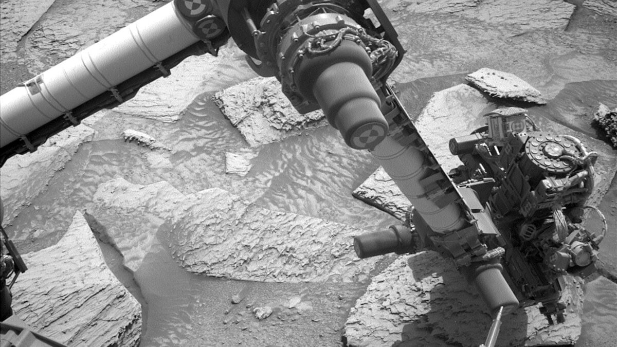 Watch NASA's Curiosity Rover Struggle to Break Loose From a Rock on Mars