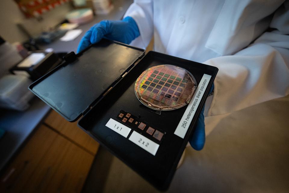 UCLA PhD Student in electrical engineering, Jui-Han Liu, shows a semiconductor wafer with chiplets attached at the Center for Heterogeneous and Performance Scaling laboratory during the official launch of the Semiconductor Hub at the UCLA Samueli School of Engineering in Los Angeles, on May 21, 2026. (Photo by ETIENNE LAURENT / AFP via Getty Images)