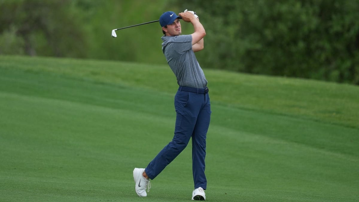 Davis Thompson watches his approach shot on the 17th hole during the 2026 Valero Texas Open at TPC San Antonio.