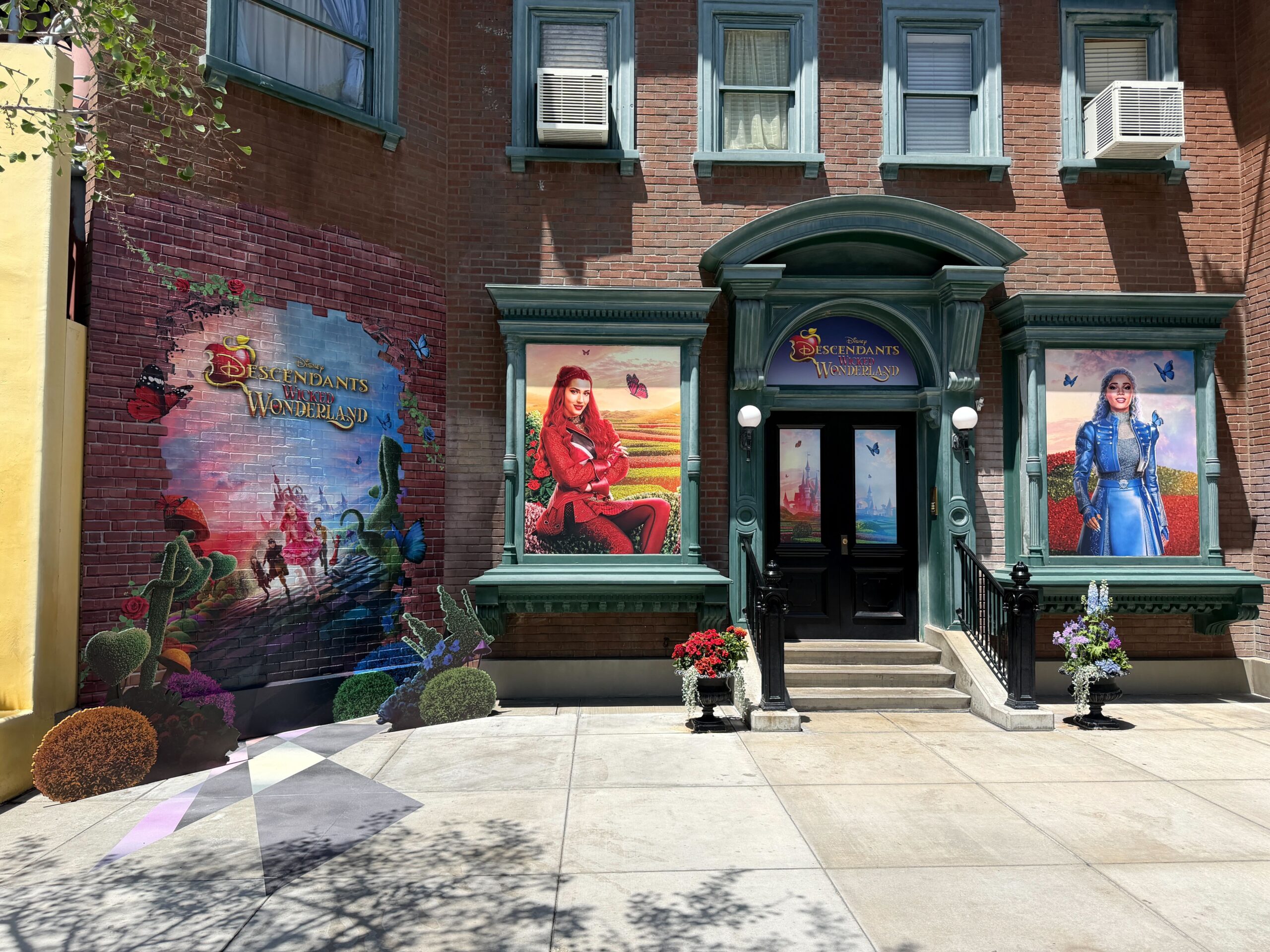 The display spans all across the brick facade, as well as the doors and windows of the building.