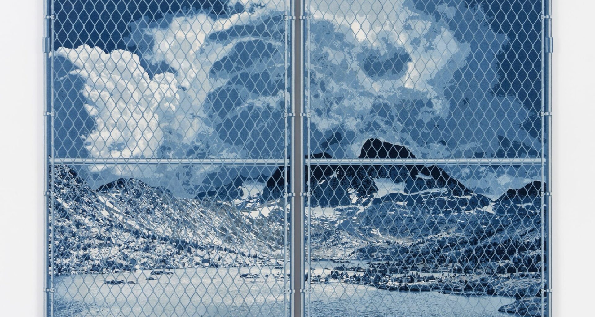 a large denim wall sculpture by Nick Doyle of a landscape behind a chain link fence