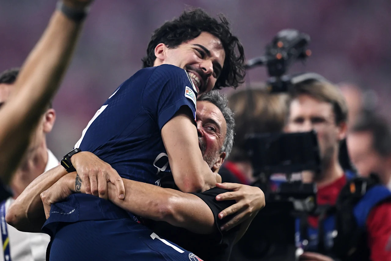 BUDAPEST, HUNGARY - MAY 30:  Vitinha and Luis Enrique of Paris Saint Germain celebrates at the end  the UEFA Champions League Final 2026 match between Paris Saint-Germain and Arsenal FC at Puskas Arena on May 30, 2026 in Budapest, Hungary. (Photo by Image Photo Agency/Getty Images)