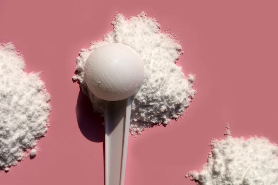 White creatine powder used as a pre-workout performance booster.