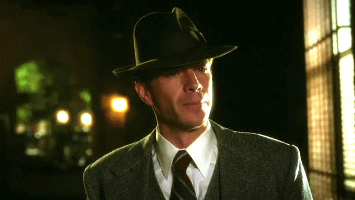 James D'Arcy's Edwin Jarvis wearing a hat and a suit.