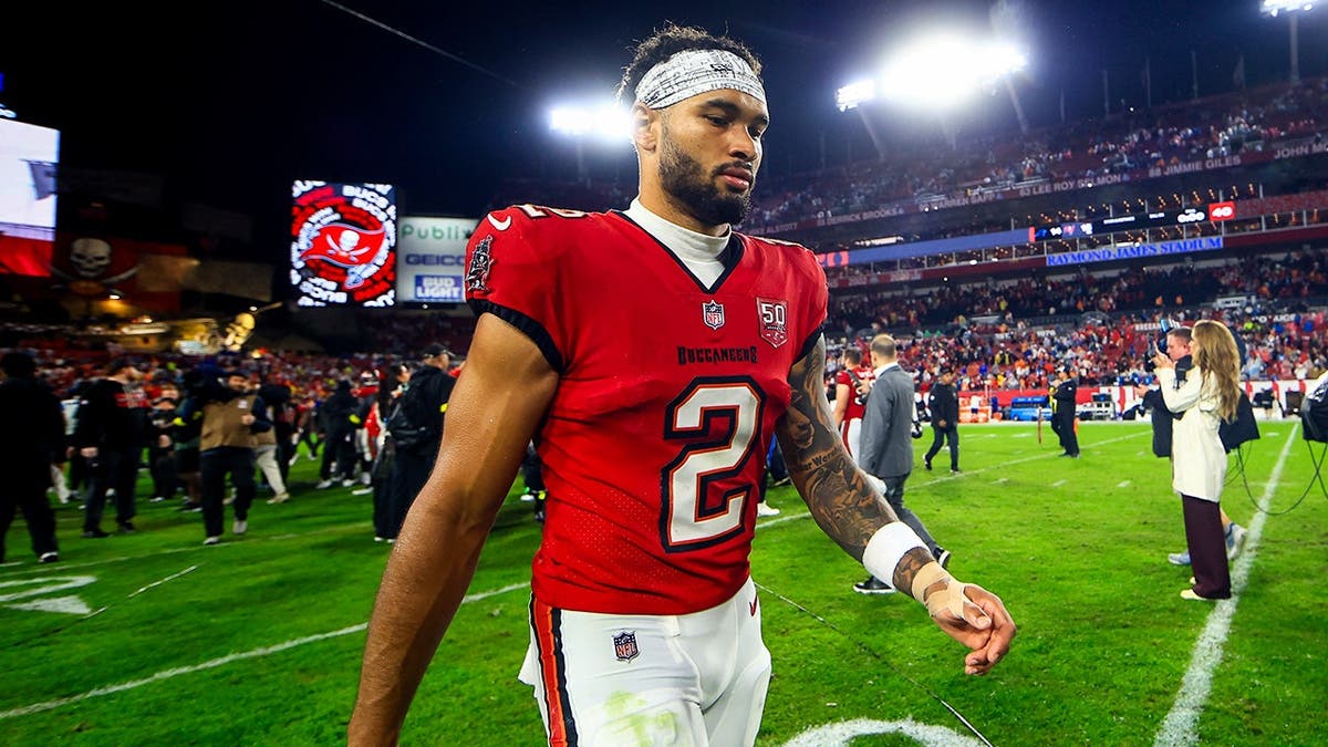 Emeka Egbuka walking off the field at Raymond James Stadium in Tampa