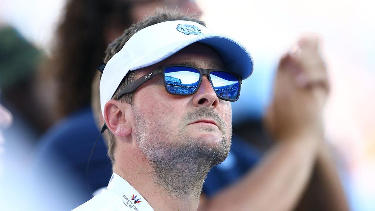 Country music artist Eric Church attending a football game at Bank of America Stadium