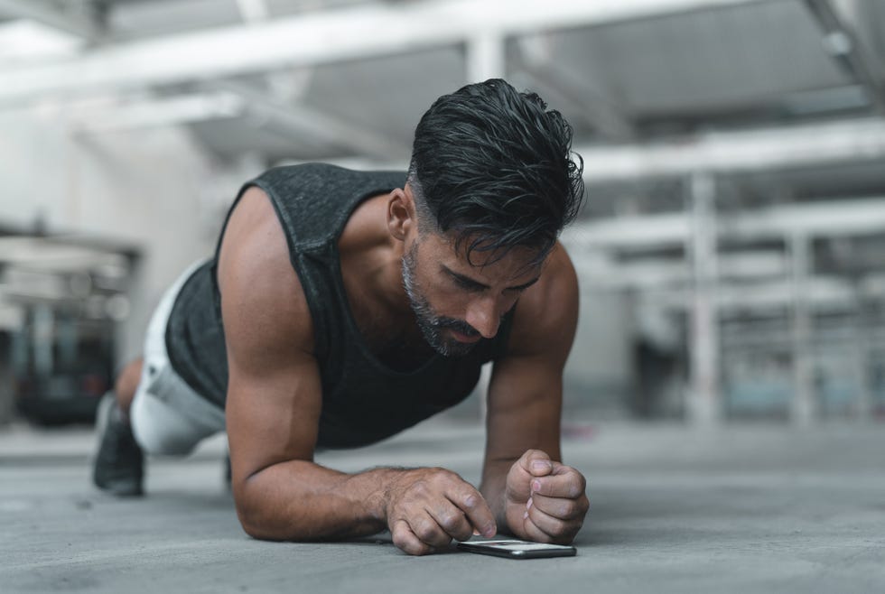 Exercising with a Smart Phone while in Plank Position Exercising with a Smart Phone while in Plank Position