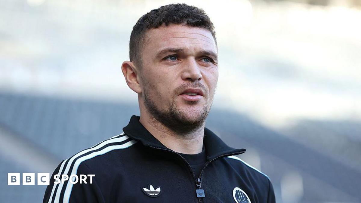 Kieran Trippier in a Newcastle United training tracksuit top, which is in club colours - black with white trim