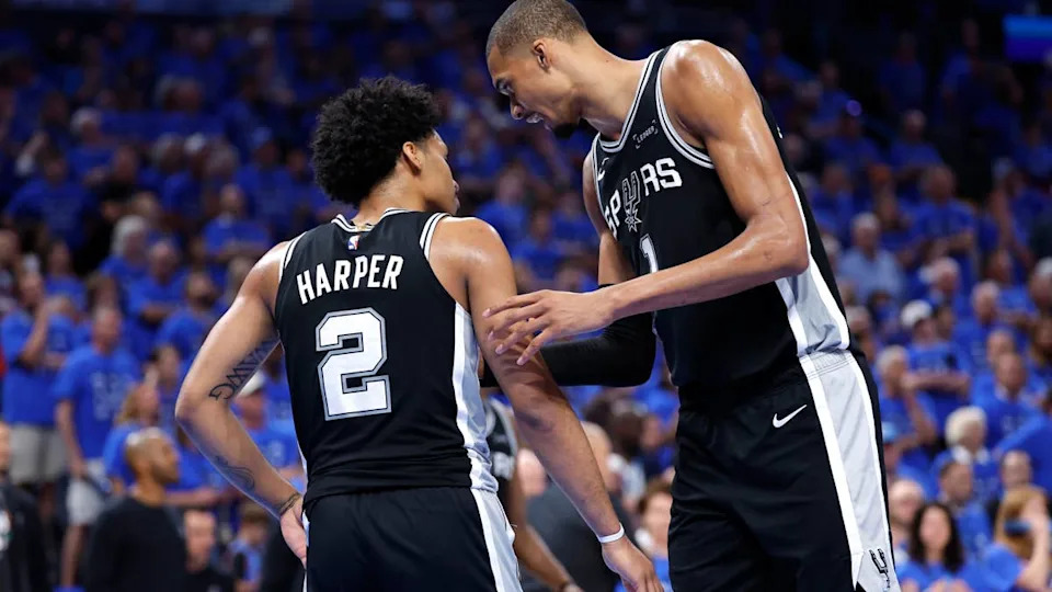 San Antonio Spurs forward <a class="link " href="https://sports.yahoo.com/nba/players/10094/" data-i13n="sec:content-canvas;subsec:anchor_text;elm:context_link" data-ylk="slk:Victor Wembanyama;sec:content-canvas;subsec:anchor_text;elm:context_link;itc:0" data-yga="{"yLinkElement":"context_link","yModuleName":"content-canvas","yLinkText":"Victor Wembanyama","ySubModuleName":"anchor_text","yHasCommerce":false}">Victor Wembanyama</a> (1), guard Dylan Harper (2) against the <a class="link " href="https://sports.yahoo.com/nba/teams/oklahoma-city/" data-i13n="sec:content-canvas;subsec:anchor_text;elm:context_link" data-ylk="slk:Oklahoma City;sec:content-canvas;subsec:anchor_text;elm:context_link;itc:0" data-yga="{"yLinkElement":"context_link","yModuleName":"content-canvas","yLinkText":"Oklahoma City","ySubModuleName":"anchor_text","yHasCommerce":false}">Oklahoma City</a> Thunder.© Alonzo Adams-Imagn Images