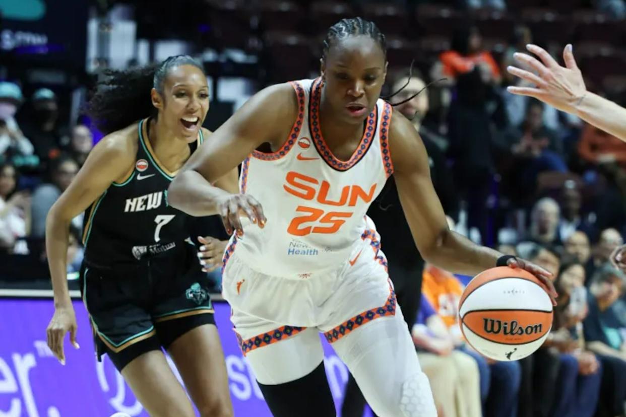 An image collage containing 1 images, Image 1 shows Kennedy Burke #25 dribbles the basketball while being guarded by a New York Liberty player