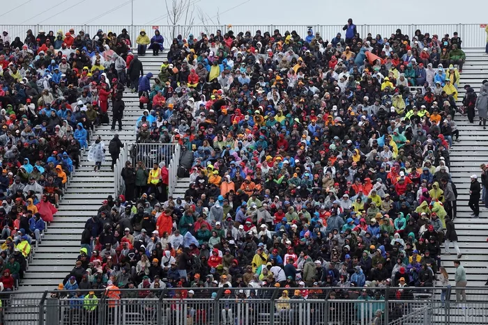 Fans fill a grandstand.