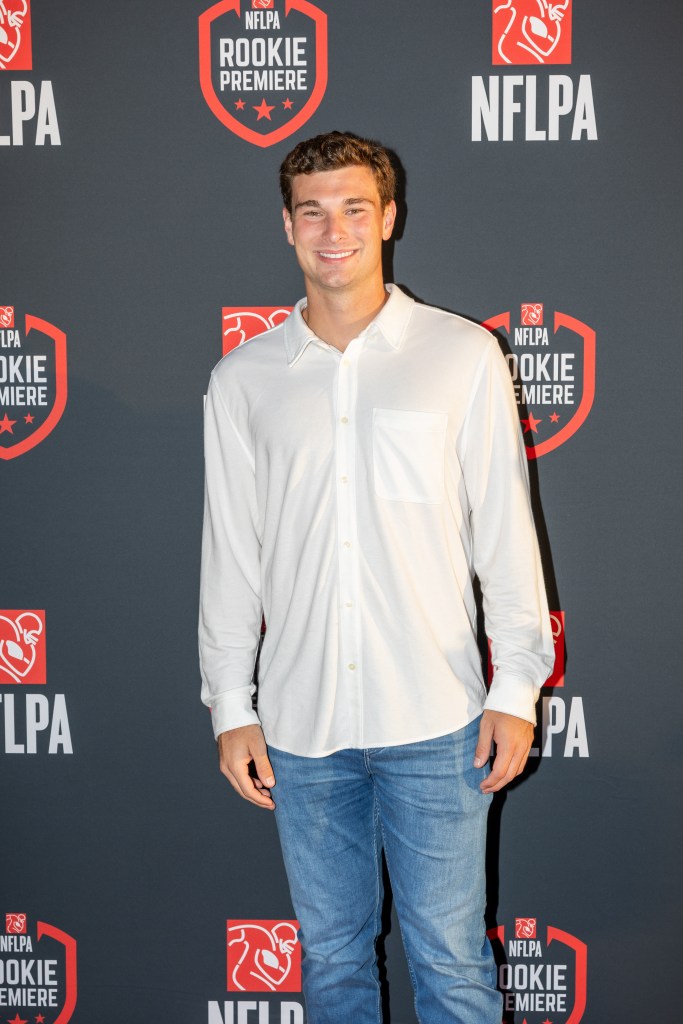 Fernando Mendoza posing on the red carpet at the NFLPA Rookie Premiere.