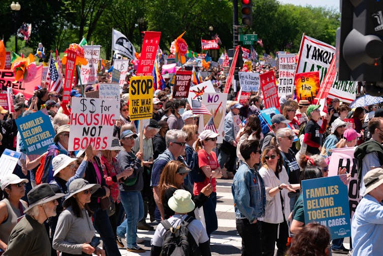 March with thousands carrying placards and banners