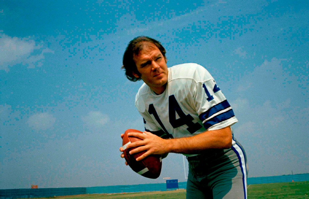 Craig Morton of the Dallas Cowboys holding a football.