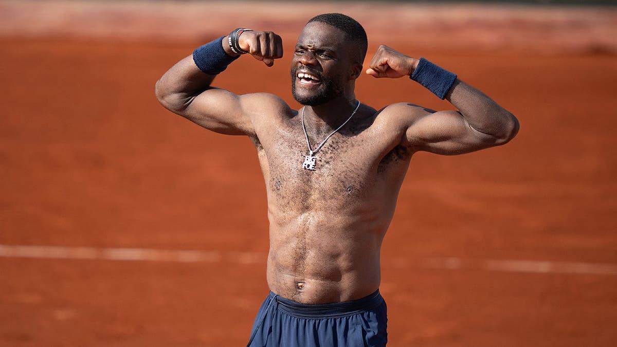 Frances Tiafoe celebrating after winning a tennis match at Stade Roland Garros