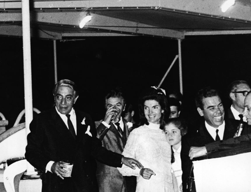 Jaqueline Kennedy Onassis with her daughter, Caroline Kennedy, and her new husband, Greek shipping magnate Aristotle Onassis, at a reception aboard the yacht, Christina, shortly after their wedding ceremony on the island of Skorpios, Greece, October 21, 1968.