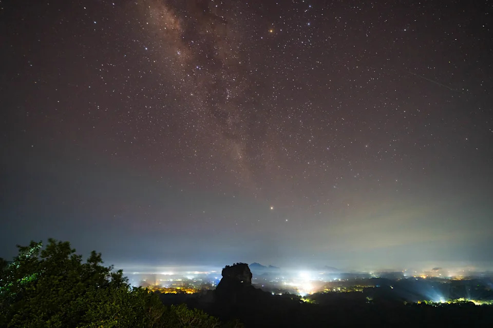 An Eta Aquarid meteor is seen over the UNESCO World Heritage Site Sigiriya Rock in Dambulla, Sri Lanka.