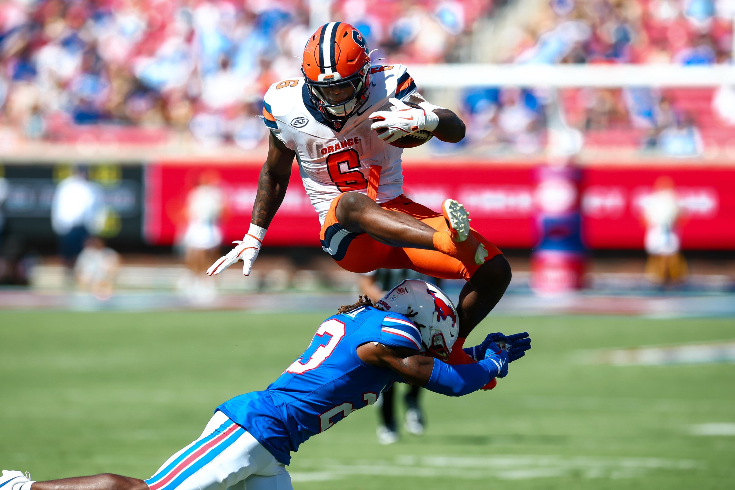DALLAS, TX - October 04: Syracuse Orange running back Yasin Willis (#6) hurdles SMU Mustangs safety Isaiah Nwokobia (#23) during the college football game between the SMU Mustangs and the Syracuse Orange on October 4, 2025, at Gerald J. Ford Stadium in Dallas, TX. (Photo by Matthew Visinsky/Icon Sportswire via Getty Images)