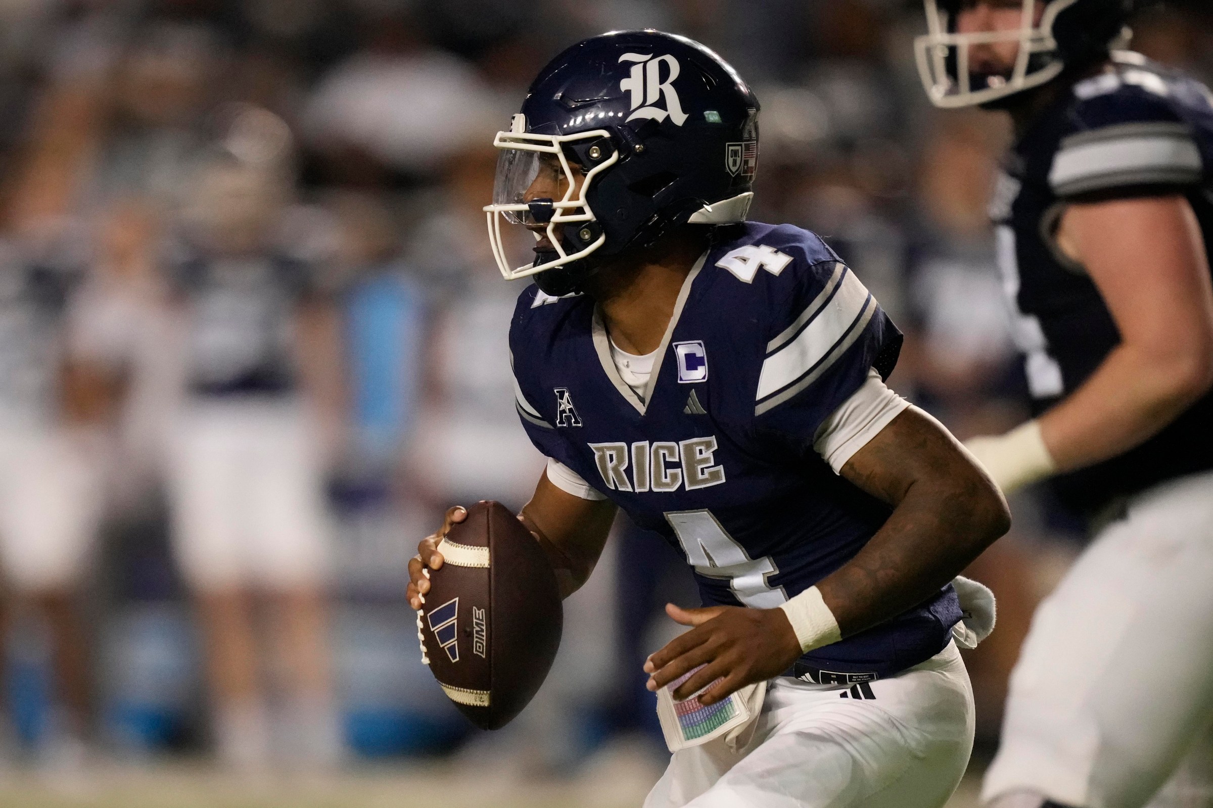 HOUSTON, TEXAS - NOVEMBER 22: Chase Jenkins #4 of the Rice Owls carries the ball during the second quarter against the North Texas Mean Green at Rice Stadium on November 22, 2025 in Houston, Texas. (Photo by Kevin M. Cox/Getty Images)