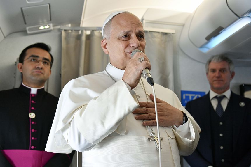 Pope Leo XIV responds to questions regarding US President Donald Trump's recent statements during the flight to Algeria on April 13, 2026 in Algiers, Algeria.