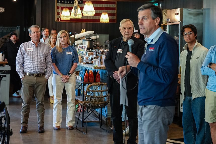Brian Kemp, governor of Georgia, left, and Marty Kemp, Georgia's first lady, second left, as Derek Dooley, Republican US Senate candidate for Georgia, second right, speaks during a campaign event at Whitetail Coffee Shop in Milton, Georgia, on Friday, May 15.