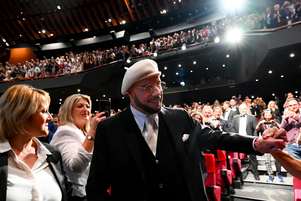 US director, screenwriter and writer John Travolta arrives to receive an honorary lifetime achievement Palm d'Or award at the 79th edition of the Cannes Film Festival on May 15, 2026.
