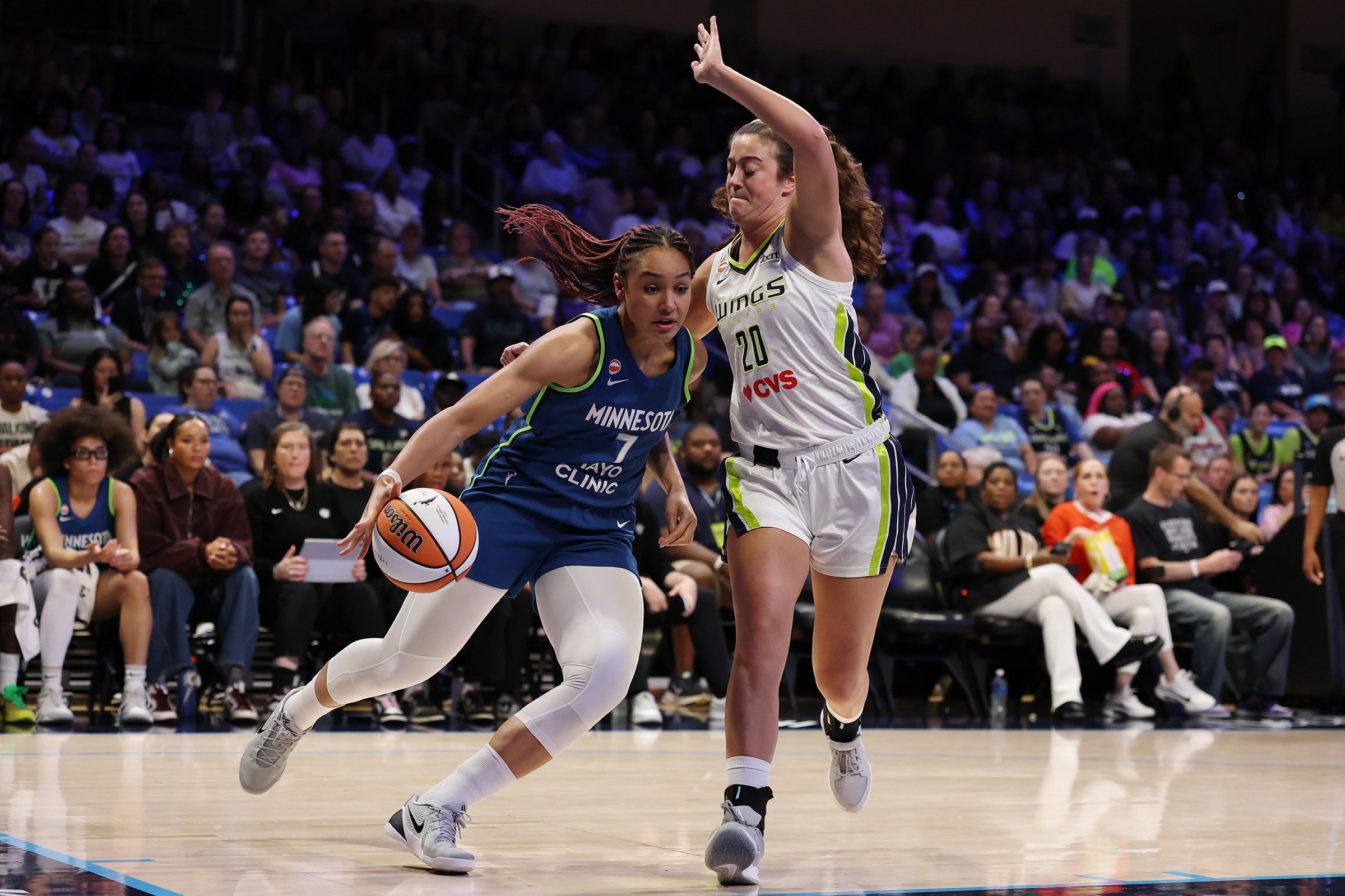ARLINGTON, TEXAS - MAY 14: Anastasiia Olairi Kosu #7 of the Minnesota Lynx is defended by Maddy Siegrist #20 of the Dallas Wings during the first half at College Park Center on May 14, 2026 in Arlington, Texas. NOTE TO USER: User expressly acknowledges and agrees that, by downloading and or using this photograph, User is consenting to the terms and conditions of the GettyImages License Agreement. (Photo by Stacy Revere/Getty Images)