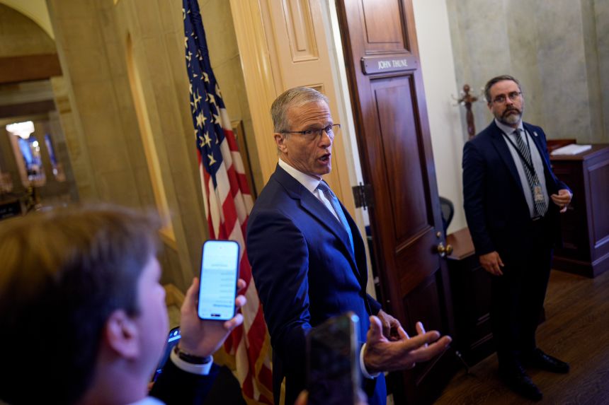 Senate Majority Leader John Thune speaks to reporters as he walks into his office at the US Capitol Building on May 21 in Washington, DC. Senate Republicans are postponing a planned budget reconciliation package vote to fund US Immigration and Customs Enforcement's (ICE) and U.S. Customs and Border Protection (CBP).