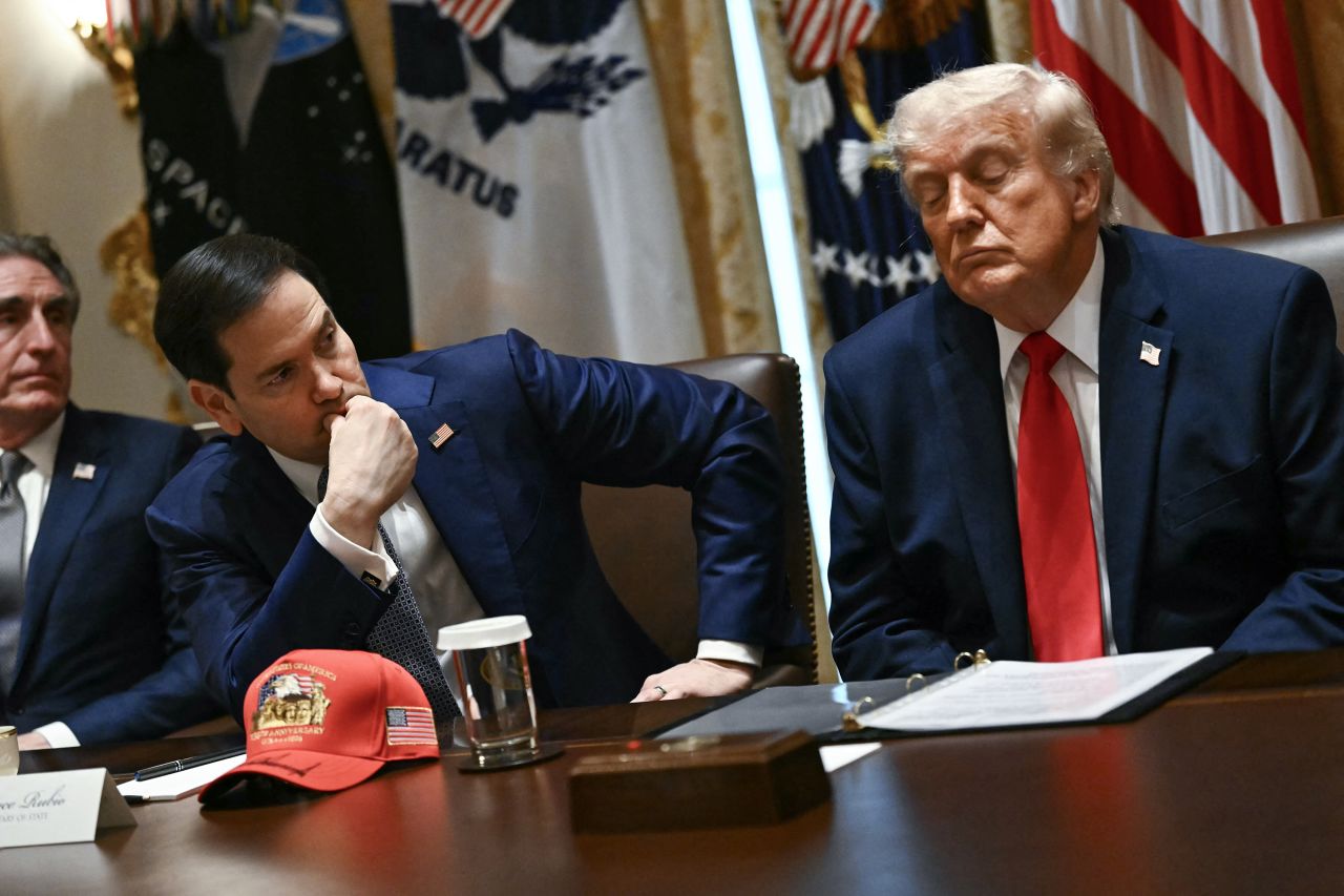 From left, US secretary of Interior Doug Burgum, US Secretary of State Marco Rubio and US President Donald Trump listen to cabinet members, during a meeting at the White House on Wednesday, May 27.