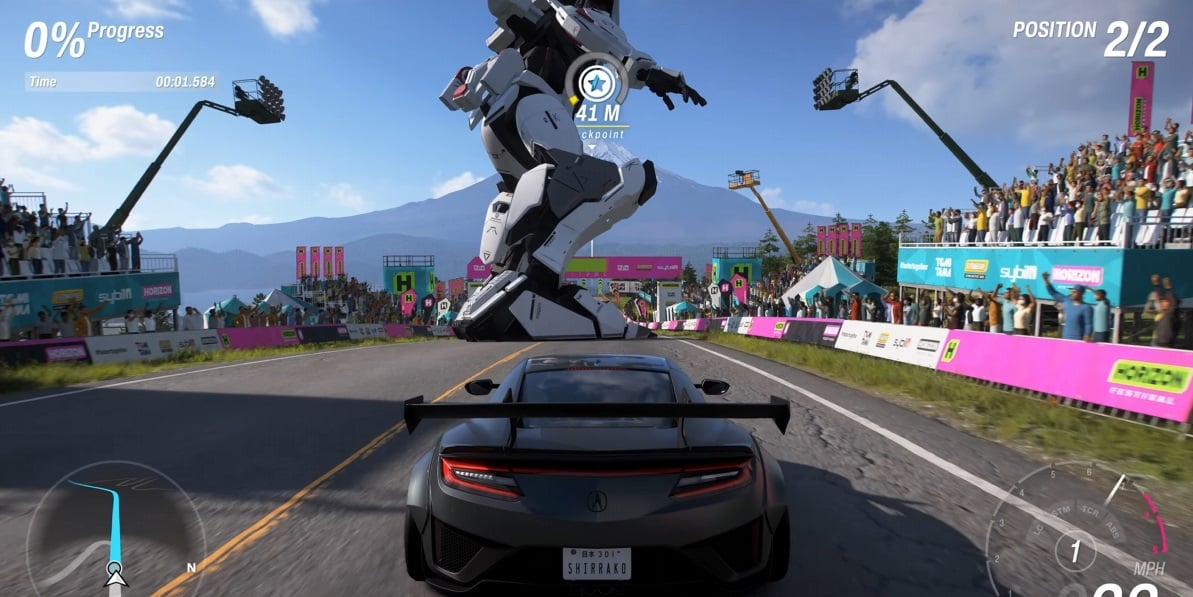 A Gundam races a car.