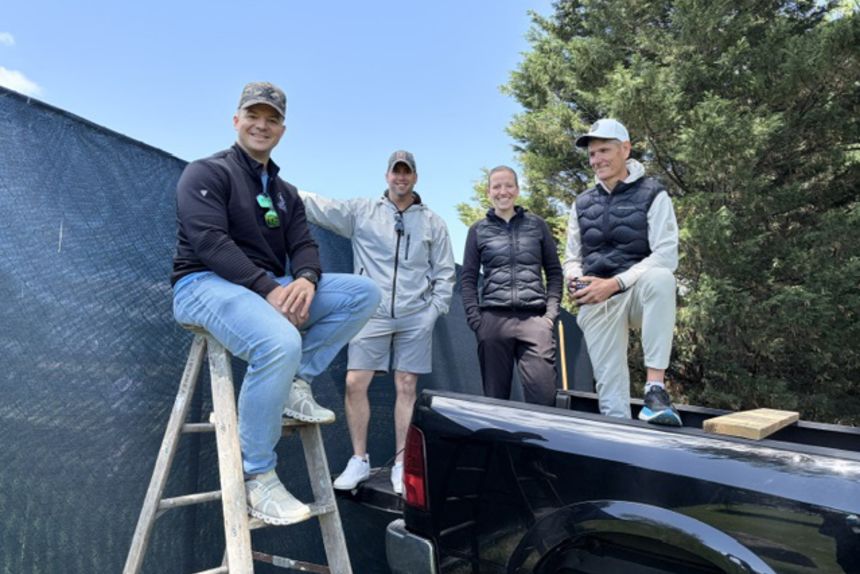From left, Pat Corcoran, Joe Spence, Theresa Supe and Dietmar Freyhammer post up by a fence to watch some of the PGA Championship at Aronimink Golf Club.
